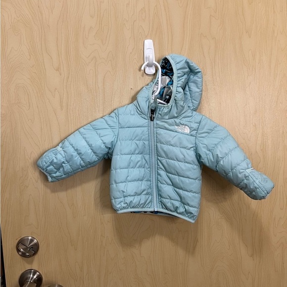 Infant NorthFace light blue and Aztec patterned reversible coat